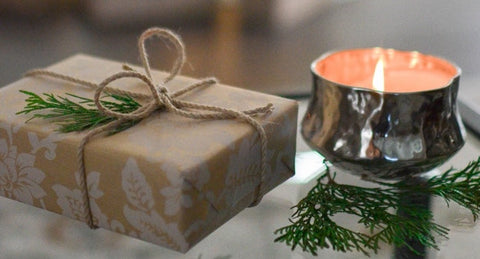 A wrapped gift and a candle | The Smile Blog | TheWhiteningStore.com