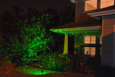 green laser projector on outdoor landscape