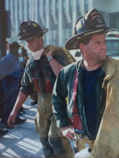A NYFD firefighter and his partner at ground zero on 9/11/2001 just after the towers fell