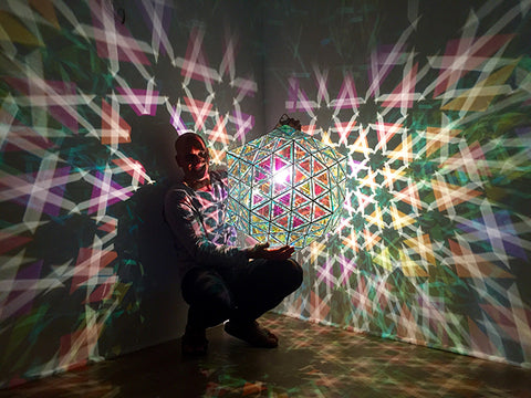 Asaf Zakay with large geometric pendant light