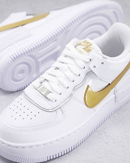 white air force ones with gold