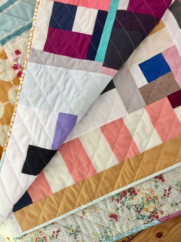 solid improv throw quilt by salty oat