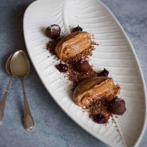 Chocolate mousse sharing platter with chocolate soil, cherry jam and salted chocolate truffles