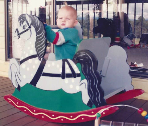 Child on Wooden Rocking Horse