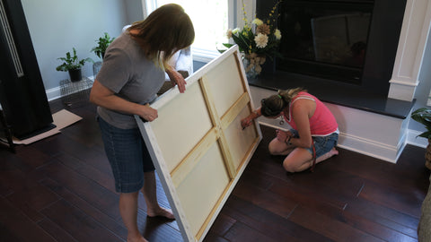 Artist Rebecca Grantham, dedicating the painting to the clients with the date, signature and personal inscription.