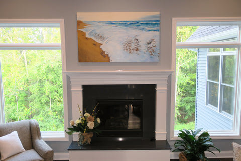 Photo of completed commissioned painting installed above the mantle in the clients new home.