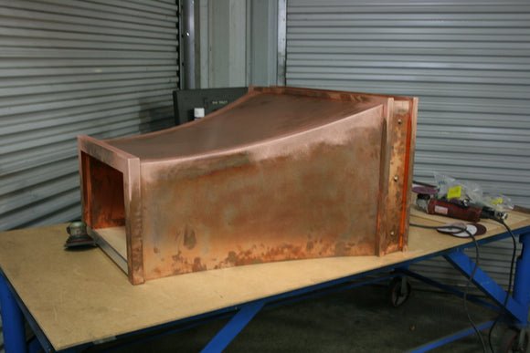 custom made copper range hood with clavos