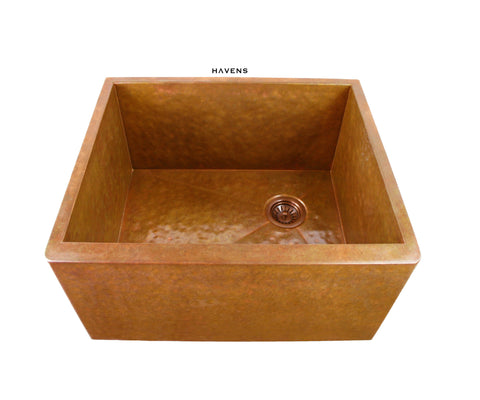 Custom copper utility sink for the laundry room with a hammered copper finish.