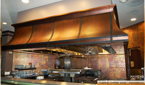 Hammered copper commercial range hood in a Orlando, FL restaurant kitchen