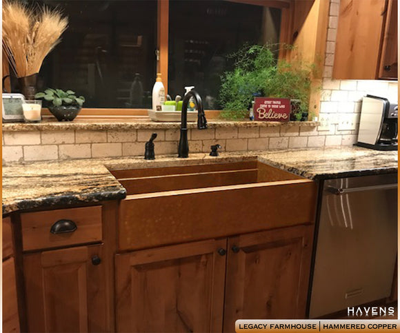 Easy to clean copper farm sink with hammered finish. 