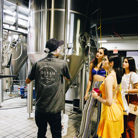Image of girls at a tour of the Ocean Lab Brewing Co.