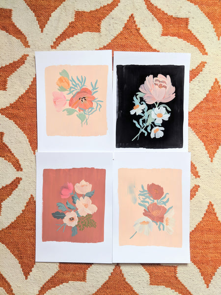 Original floral paintings laid out on the studio floor!