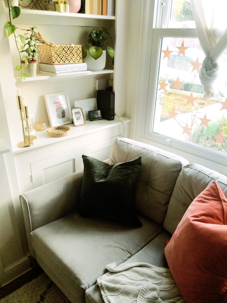 Cosy compact living room corner with built in shelving
