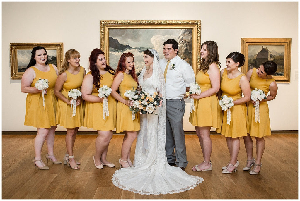 Orlando art museum wedding venue with mustard yellow vintage inspired short bridesmaid dresses