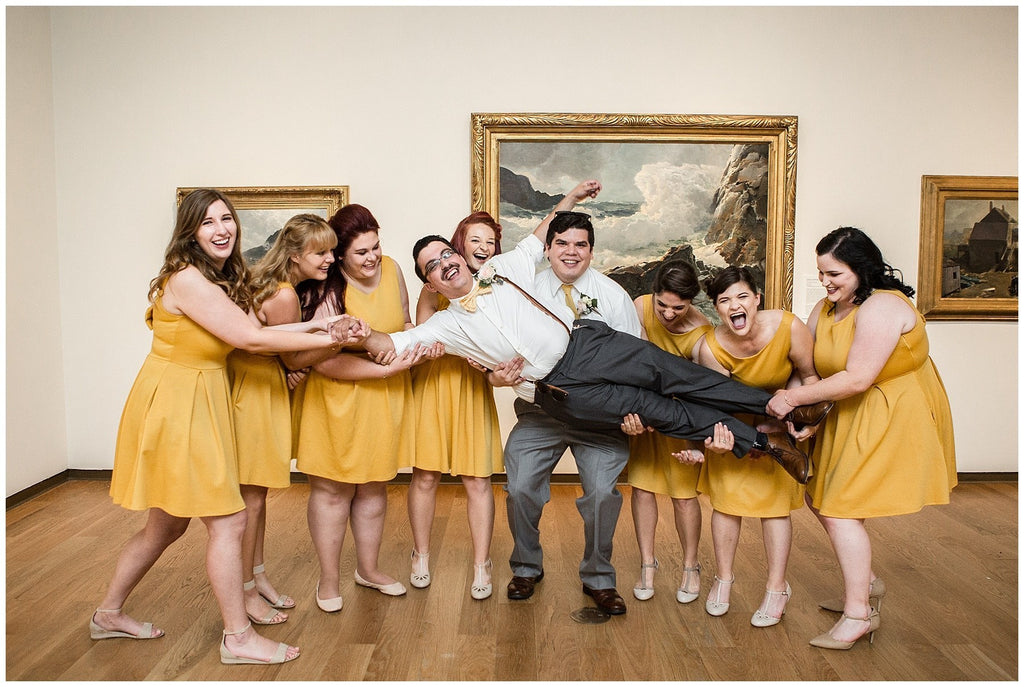 Orlando art museum wedding venue with mustard yellow vintage inspired short bridesmaid dresses