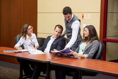 people working in an office without jackets on to prevent sweating