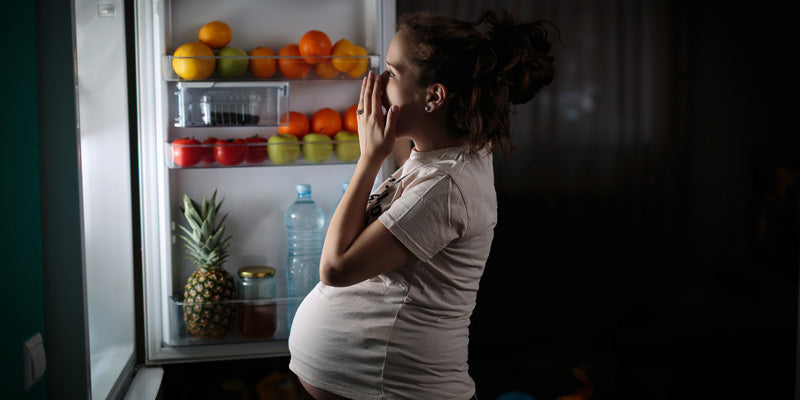 pregnant woman at fridge
