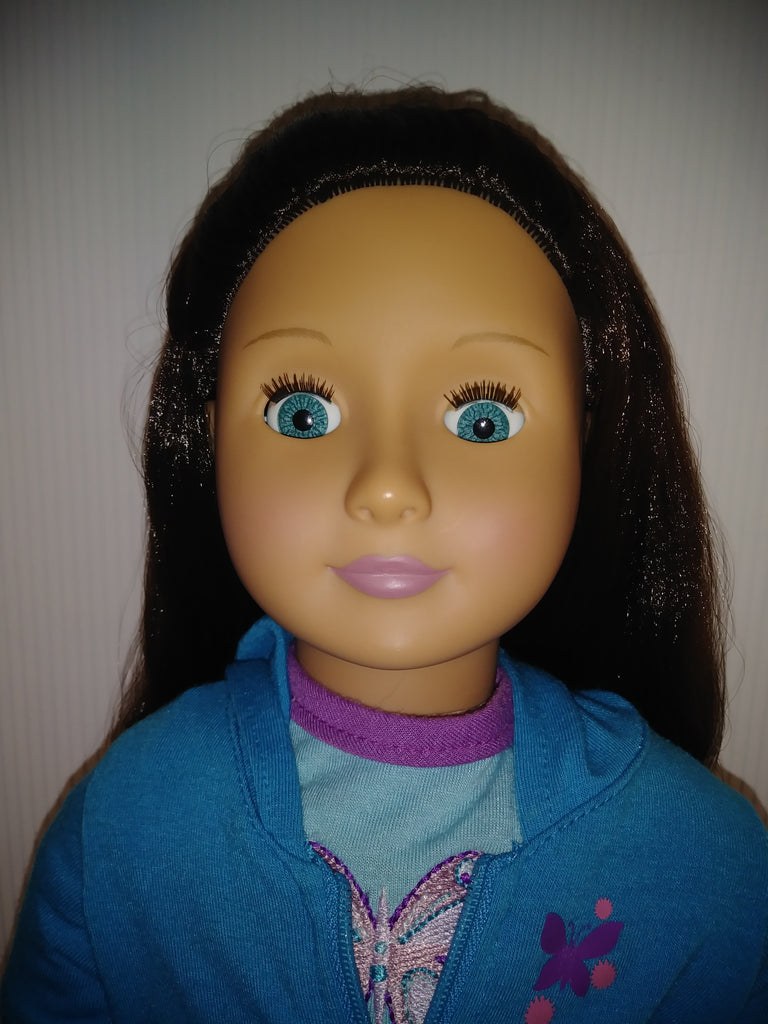 doll with brown hair and blue eyes