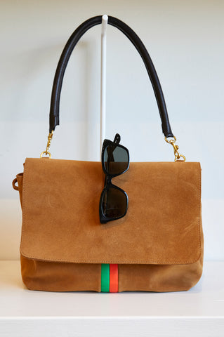 Clare V. x Garrett Leight Black Sunglasses Sitting Over A Tan Shoulder Bag 