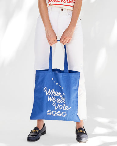 Frannie Holding Our When We All Vote Blue Canvas Tote Bag