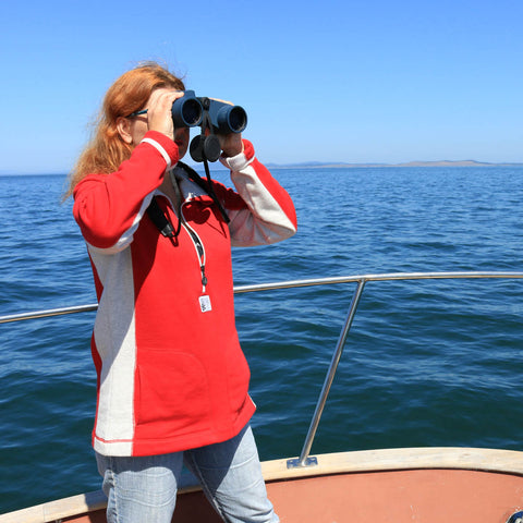 Lisa using Weems & Plath Explorer binoculars on the foredeck