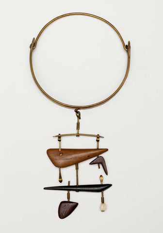 Vivianna Torun Bülow-Hübe brass necklace with hanging pendants made out of various woods and ivory
