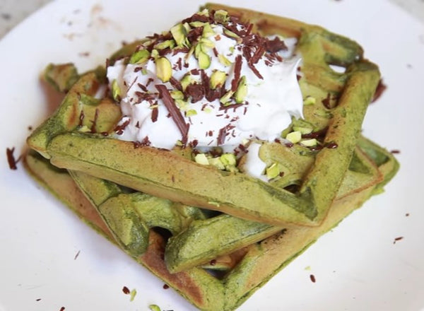 Super moist and earthly Matcha Green Tea Waffles topped with coconut whipped cream & vegan chocolate for the relaxing weekend