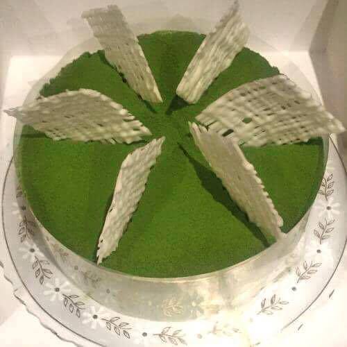 Whole matcha adzuki mousse cake topped with white chocolate decoration. Simple and delicious recipe