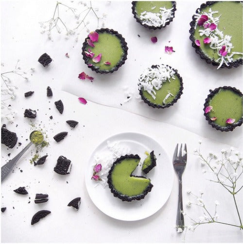 Mini Matcha Oreo Tarts - chocolatey oreo crust filled with creamy matcha filling and topped with coconut sprinkles