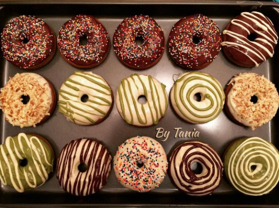 Delicious matcha green tea donuts glazed with 3 flavors of chocolate glaze, matcha chocolate, white chocolate and dark chocolate