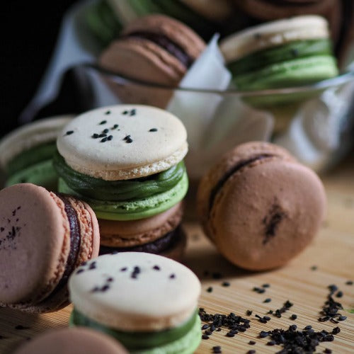 Matcha Green Tea Macarons with matcha cream filling and black sesame square crunch