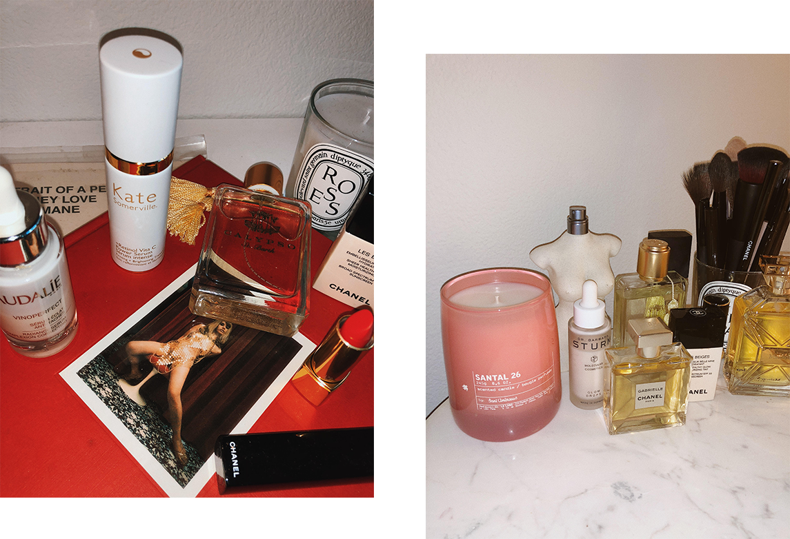 Beauty products on a counter with a candle. 