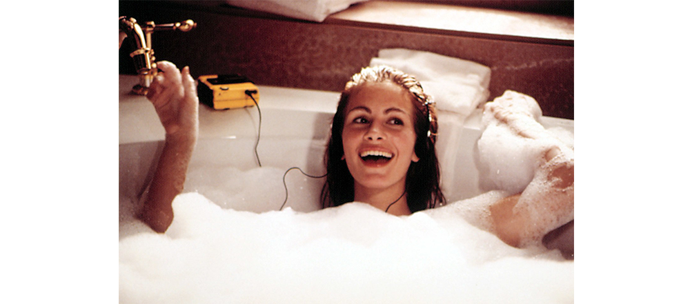 Woman taking a bubble bath. 