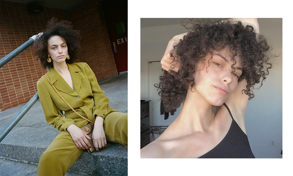 Woman sitting on steps in a green suit / woman in a black shirt with her hand on her head.