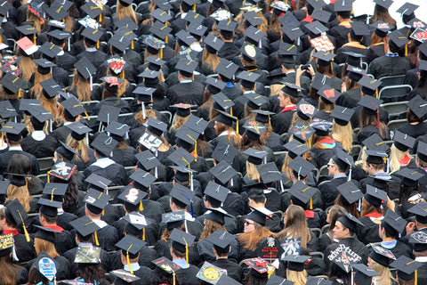 College graduates in mortarboard caps