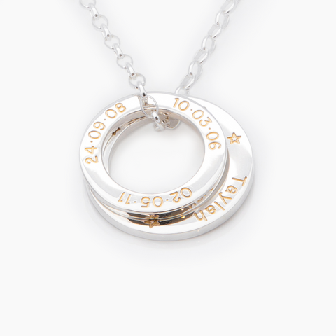 A silver LoveLoop set engraved with gold fill