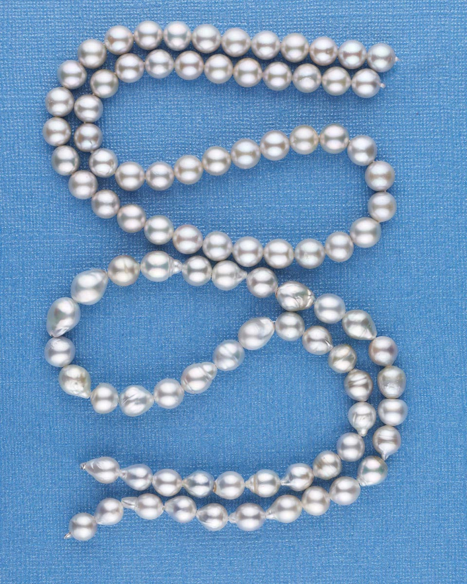 Two strands of Red Sea cultured pearls, one baroque and one round