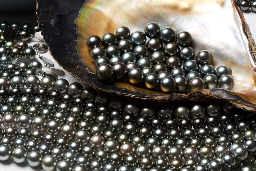 Dark and pastel, natural-color Tahitian pearls