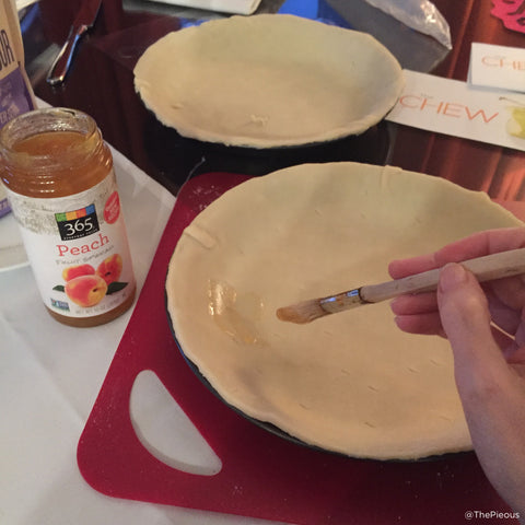 Painting the dough with jam