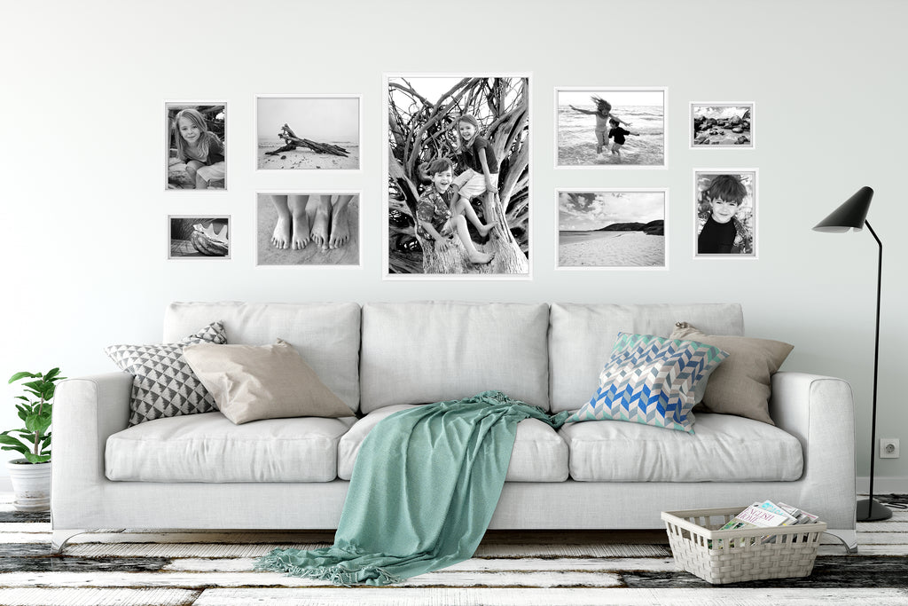 Wondering what to do with a blank wall? Want to create a Gallery Wall that WORKS? We've got tips to help you decorate your empty space, whether it's in your living room, bedroom or office -  along with a FREE ebook full of more ideas! #gallerywallideas #gallerywalllayout #blankwallideas #gallerywalllivingroom #minimalistgallerywall