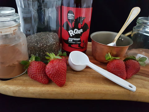 Cocoa, chia seed pudding with fresh strawberries and raspberry jam cordial Roar Living. Clean, easy dessert. Additive free, preservative free.