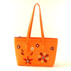 pale orange leather tote bag with flower detail 