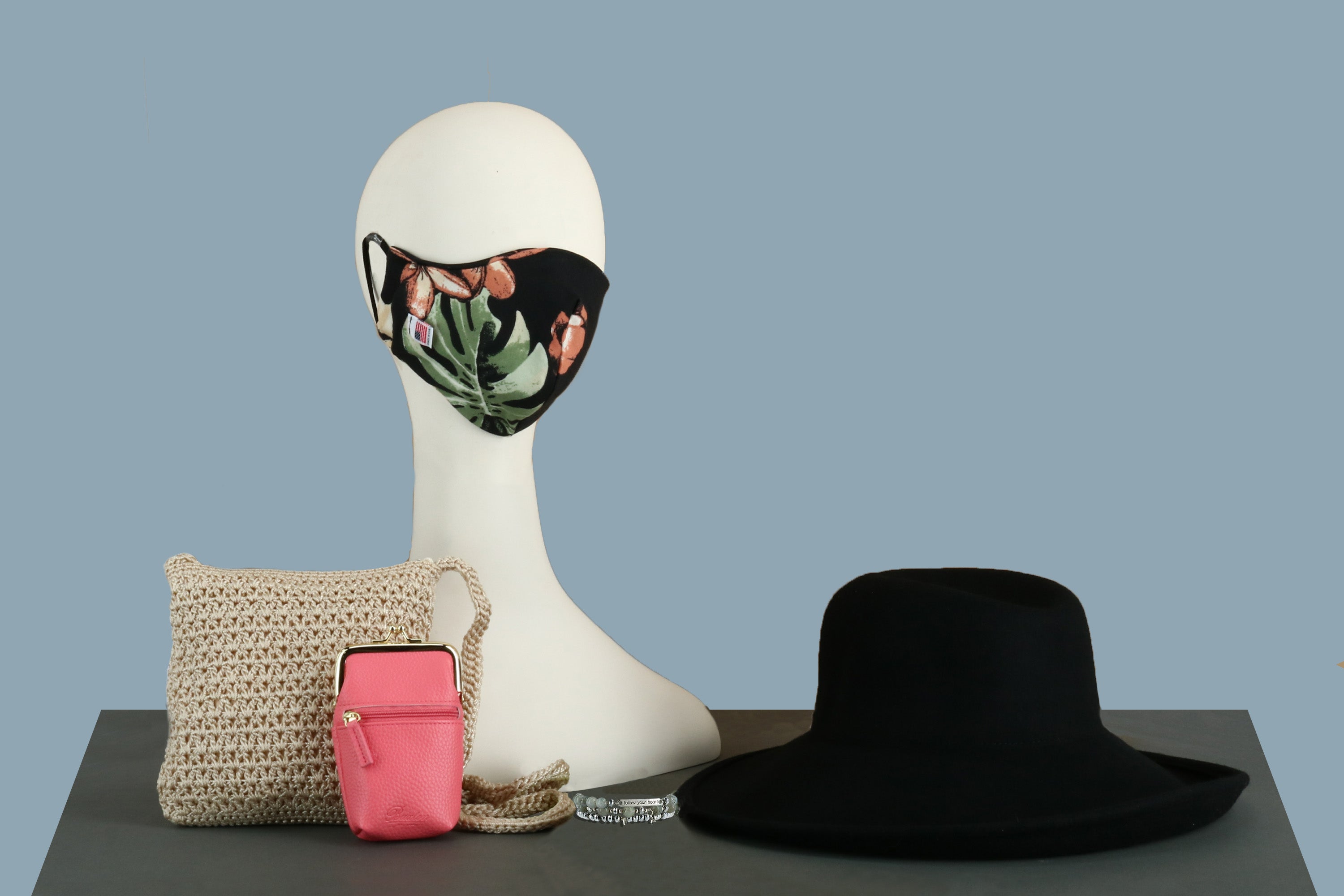 Floral face mask, black hat, knitted handbag and pink coin purse at BeltOutlet.com