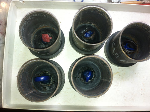 wax rings on sprue bases in flasks