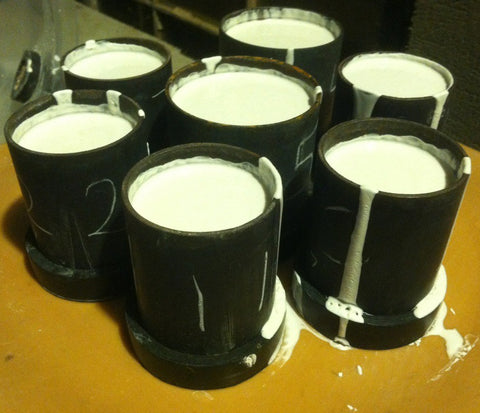 flasks after the investment was vacuumed, setting up before being placed in the kiln