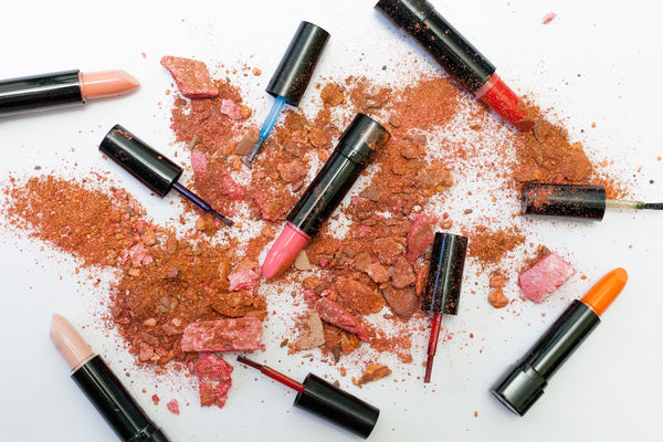 Best Mineral Makeup: Crushed up powder makeup sprinkled over lipstick tubes