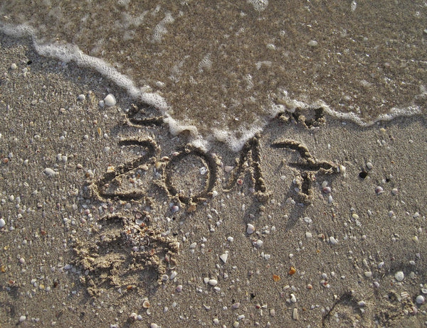 Jack Dusty Clothing and Lifestyle blog - the year 2017 etched into a sandy beach, a wave about to come and wash it away