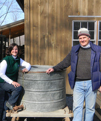 Janet and Churchill Franklin in front of sugarhouse 