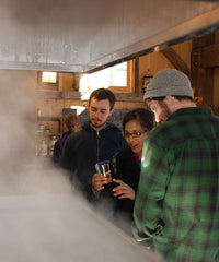 middlebury students looking at evaporator