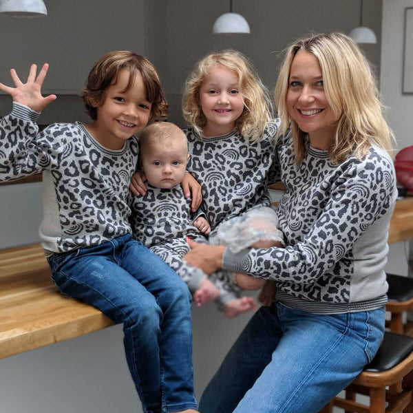 Zoe de Pass and family in twinning leopard sweaters